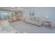 Spacious living room and dining room with water views through the sliding glass door at 7050 Sunset S Dr # 912, South Pasadena, FL 33707