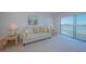 Bright living room featuring sliding glass doors offering amazing water views at 7050 Sunset S Dr # 912, South Pasadena, FL 33707