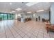 An inviting lobby with ample seating areas, tile floors, and large windows showcasing scenic views at 7050 Sunset S Dr # 912, South Pasadena, FL 33707