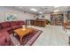 Relaxing lounge featuring a cozy couch, coffee table, bookshelves, and ample seating at 7050 Sunset S Dr # 912, South Pasadena, FL 33707