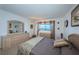 Bright main bedroom with natural light, large window, and ample storage space at 7050 Sunset S Dr # 912, South Pasadena, FL 33707