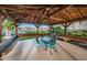 Charming outdoor patio with seating under a wooden gazebo, perfect for relaxing and enjoying the view at 7050 Sunset S Dr # 912, South Pasadena, FL 33707