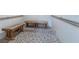 Modern shower facility with tiled walls, wooden benches, and accessibility features at 7050 Sunset S Dr # 912, South Pasadena, FL 33707
