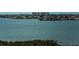 Picturesque water view showcasing calm blue waters, distant city buildings, and serene landscape at 7050 Sunset S Dr # 912, South Pasadena, FL 33707