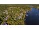 Scenic aerial view of waterfront property and tree-lined neighborhood at 8013 Linesider Dr, Riverview, FL 33578