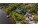 Waterfront home aerial view showcasing the expansive lawn and private dock at 8013 Linesider Dr, Riverview, FL 33578