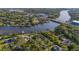 An elevated view of a waterfront community showcasing the waterways and nearby cityscape at 8013 Linesider Dr, Riverview, FL 33578