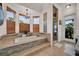 Bright bathroom featuring a soaking tub, glass block window and glass enclosed shower at 8013 Linesider Dr, Riverview, FL 33578