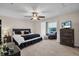 Comfortable bedroom featuring a ceiling fan, a large bed, and a window with natural light at 8013 Linesider Dr, Riverview, FL 33578