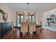 Bright dining room with hardwood floors and stylish furnishings and decor at 8013 Linesider Dr, Riverview, FL 33578
