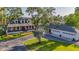 Beautifully landscaped home with a detached garage and convenient covered parking at 8013 Linesider Dr, Riverview, FL 33578