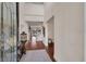 Bright foyer featuring hardwood floors, high ceilings, and a view of the lake at 8013 Linesider Dr, Riverview, FL 33578