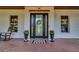 Charming front door with decorative glass, brick porch, and inviting details at 8013 Linesider Dr, Riverview, FL 33578