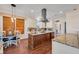 Charming kitchen with granite countertops, stainless steel appliances, wood floors, and a cozy breakfast nook at 8013 Linesider Dr, Riverview, FL 33578