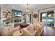 Bright living room featuring modern fireplace and views of the lake at 8013 Linesider Dr, Riverview, FL 33578