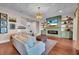 Comfortable living room with fireplace, built-in shelving, and stylish decor at 8013 Linesider Dr, Riverview, FL 33578