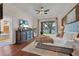 Primary bedroom features a lake view, plush carpet, ensuite bathroom, and elegant furnishings at 8013 Linesider Dr, Riverview, FL 33578