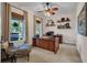 Well-lit office with hardwood furnishings, comfortable seating, and natural light at 8013 Linesider Dr, Riverview, FL 33578