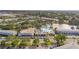 Expansive aerial showcasing the community buildings, pool, pond and well-manicured landscaping at 8533 110Th St # 207, Seminole, FL 33772