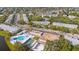 Panoramic aerial view of the community, highlighting the pool, shuffleboard, and residential buildings at 8533 110Th St # 207, Seminole, FL 33772