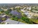 Scenic aerial view featuring a community pond, pool, and surrounding lush landscaping and residential buildings at 8533 110Th St # 207, Seminole, FL 33772
