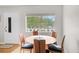 Cozy dining area featuring a round table, seating four, by a bright window at 8533 110Th St # 207, Seminole, FL 33772