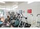 Gym with exercise equipment and signs for health safety at 8533 110Th St # 207, Seminole, FL 33772
