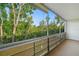 A comfortable lanai that offers breathtaking views of the surrounding greenery and a seating area at 8533 110Th St # 207, Seminole, FL 33772