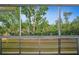Enclosed sunroom with beautiful views of mature trees at 8533 110Th St # 207, Seminole, FL 33772