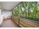 A comfortable lanai that offers breathtaking views of the surrounding greenery and a seating area at 8533 110Th St # 207, Seminole, FL 33772