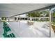 Spacious outdoor patio with tables, chairs, benches, and shaded areas for community gatherings at 8533 110Th St # 207, Seminole, FL 33772