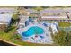 Aerial view of a sparkling pool area with lounge chairs and well-maintained landscaping at 8533 110Th St # 207, Seminole, FL 33772