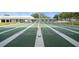 Several shuffleboard courts, meticulously striped and numbered and shaded at 8533 110Th St # 207, Seminole, FL 33772