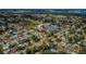 Aerial view of a residential neighborhood with tree-lined streets and manicured lawns at 9101 86Th Ave, Seminole, FL 33777