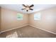 Bedroom with a ceiling fan and windows bringing in natural light at 9101 86Th Ave, Seminole, FL 33777
