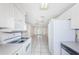 Open-concept kitchen with access to the living area and white appliances at 9101 86Th Ave, Seminole, FL 33777