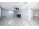 Open-concept living room featuring tile flooring, with natural light, and neutral paint at 9101 86Th Ave, Seminole, FL 33777