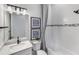 Bright bathroom featuring modern fixtures and elegant tile work at 10388 Sun Isle Dr, Englewood, FL 34223