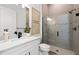 Modern bathroom features a glass-enclosed shower and sleek fixtures at 10388 Sun Isle Dr, Englewood, FL 34223