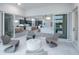 Covered patio leads to modern kitchen, dining, and living area at 10388 Sun Isle Dr, Englewood, FL 34223