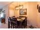 Cozy dining room with modern lighting and a view of the living area at 10425 Yellow Spice Ct, Riverview, FL 33578