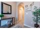Inviting entryway with tiled floors, decorative mirror and console table with decor at 10425 Yellow Spice Ct, Riverview, FL 33578