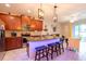 Open kitchen featuring a breakfast bar, stainless steel appliances, and ample cabinet space at 10425 Yellow Spice Ct, Riverview, FL 33578