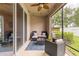 Relaxing screened lanai with comfortable seating and views of the backyard at 10425 Yellow Spice Ct, Riverview, FL 33578