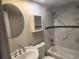 Updated bathroom features tub/shower combo with decorative tile and new fixtures at 11715 Salmon Dr, Port Richey, FL 34668