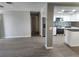 Open floor plan showcasing the modern kitchen and living room layout with stainless appliances at 11715 Salmon Dr, Port Richey, FL 34668