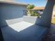 Covered patio area with privacy wall perfect for outdoor relaxation and entertaining at 11715 Salmon Dr, Port Richey, FL 34668
