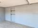 Spacious room featuring new floors, textured walls, and alcove with built-in shelves at 11715 Salmon Dr, Port Richey, FL 34668