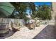 An outdoor oasis with a brick patio and a comfortable seating area under the shade of mature trees at 13215 Beechberry Dr, Riverview, FL 33579