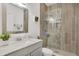 Stylish bathroom boasts a glass-enclosed shower and sleek vanity with marble countertops at 13215 Beechberry Dr, Riverview, FL 33579